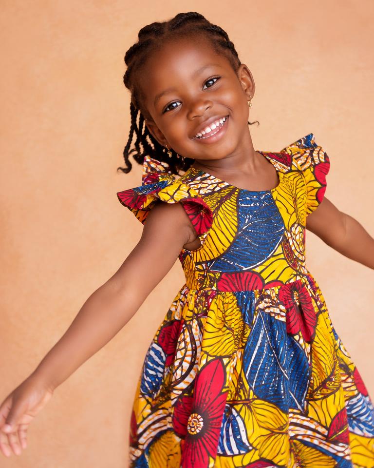 Shahaznaan Kids — smiling girl in a colourful dress